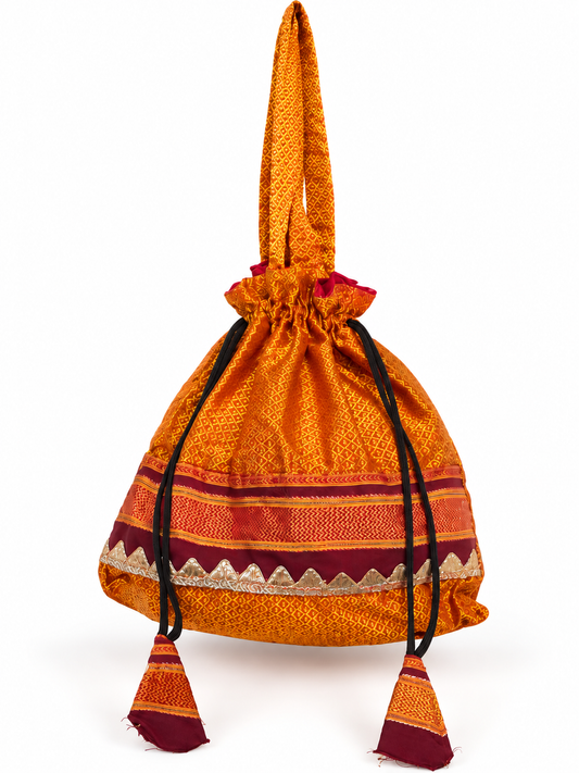 Orange Gold Potli Bag with Traditional Woven Pattern, Maroon Border, Drawstring Closure, Matching Tassels and Elegant Ethnic Detailing for Festivals