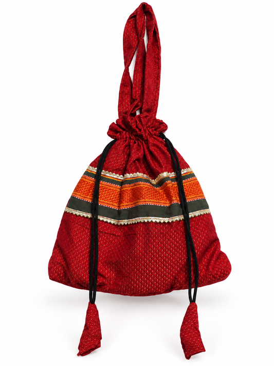 Red Potli Bag with Traditional Woven Pattern, Maroon and Orange Borders, Drawstring Closure, Matching Tassels and Elegant Ethnic Detailing